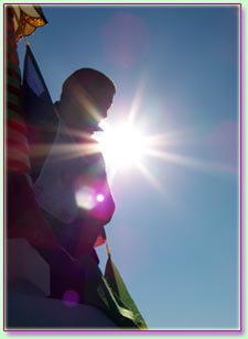 Monk Hangs Prayer Flags